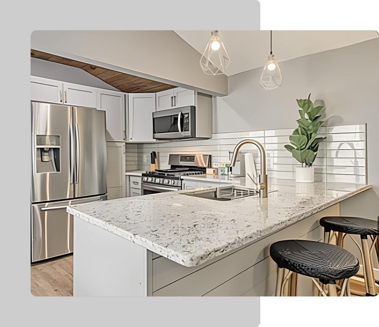 A kitchen with white cabinets and stainless steel appliances.