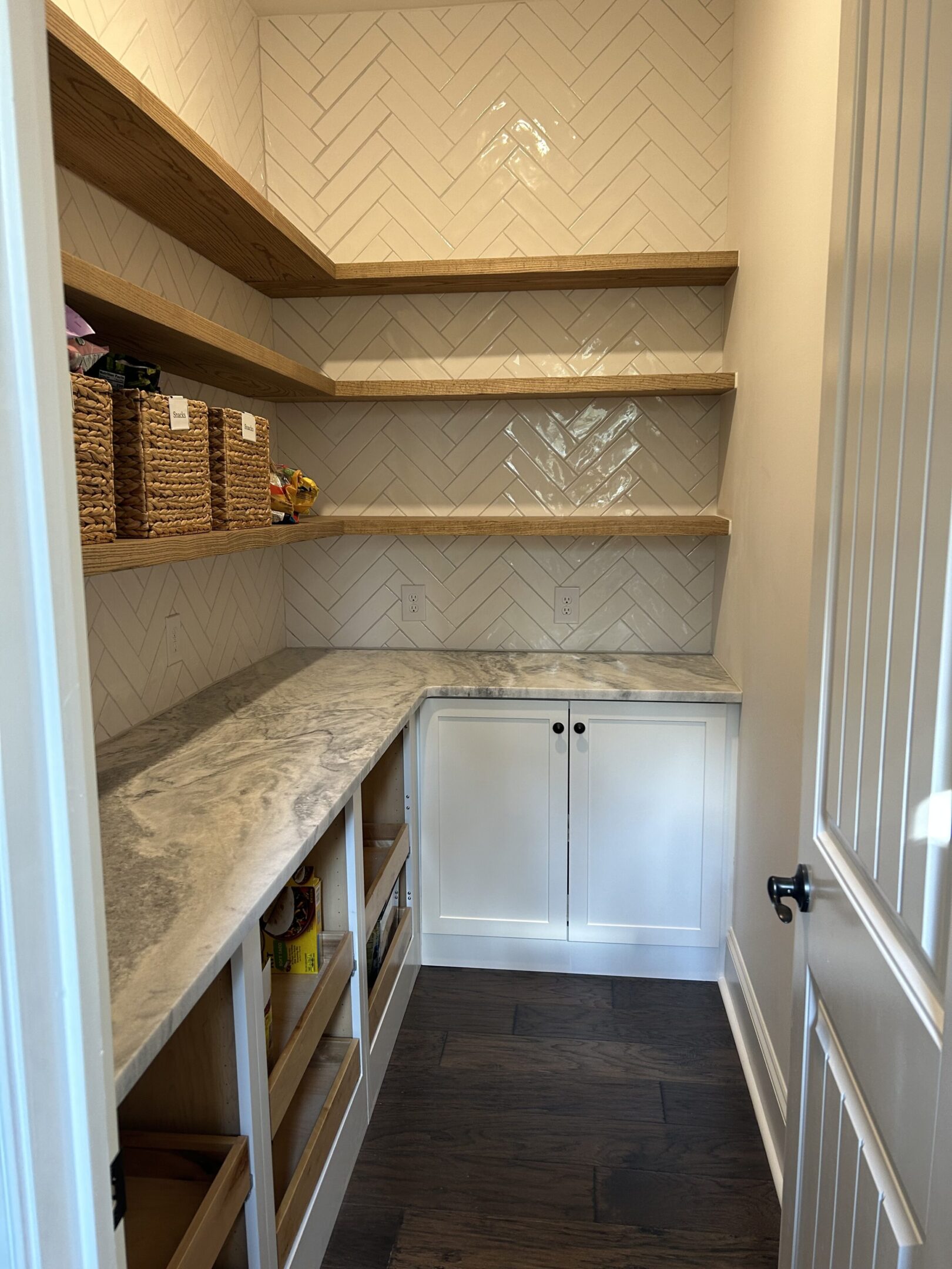 A kitchen with shelves and cabinets in it