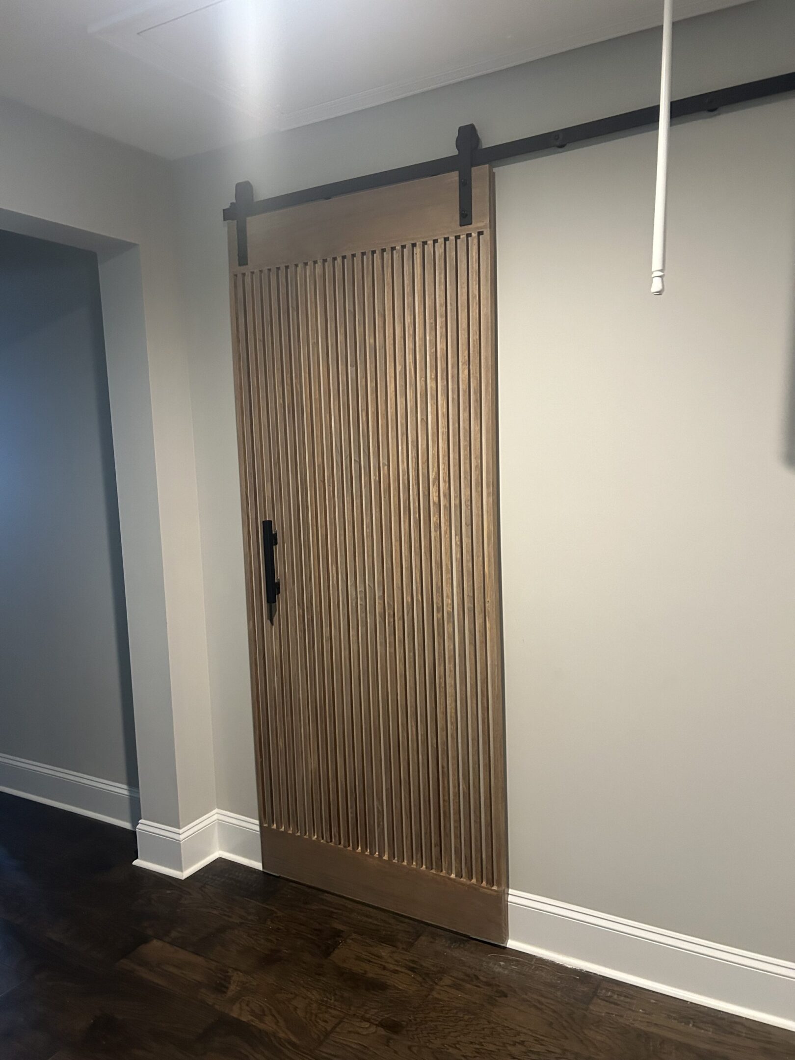 A door that is made of wood and has a metal handle.