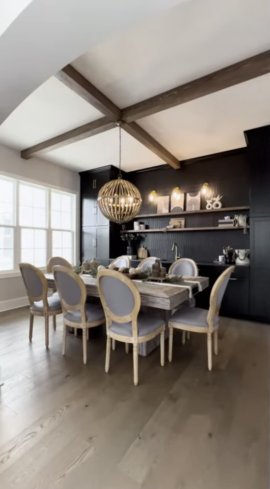 A dining room with a table and chairs