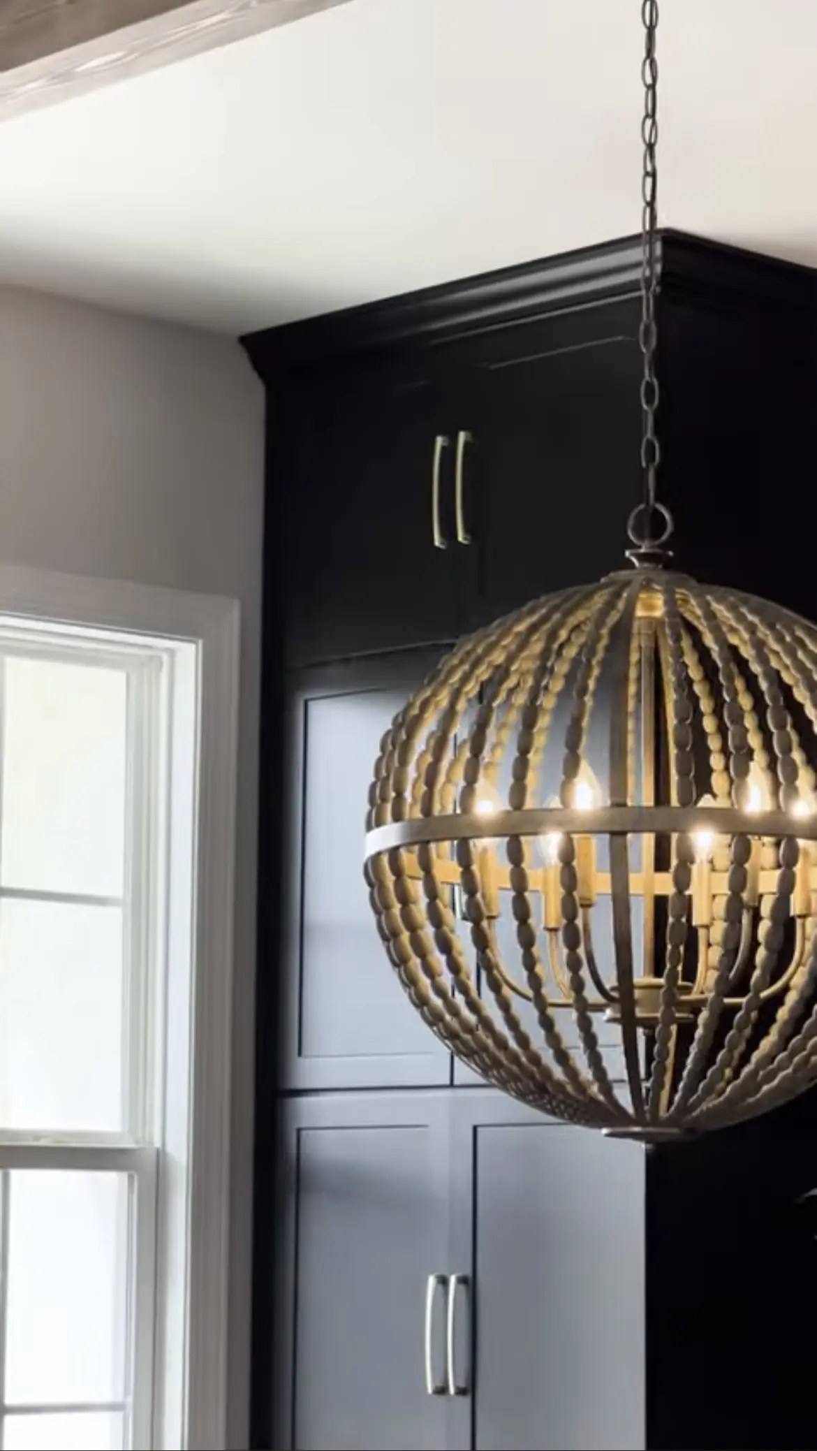 A chandelier hanging in the middle of a room.