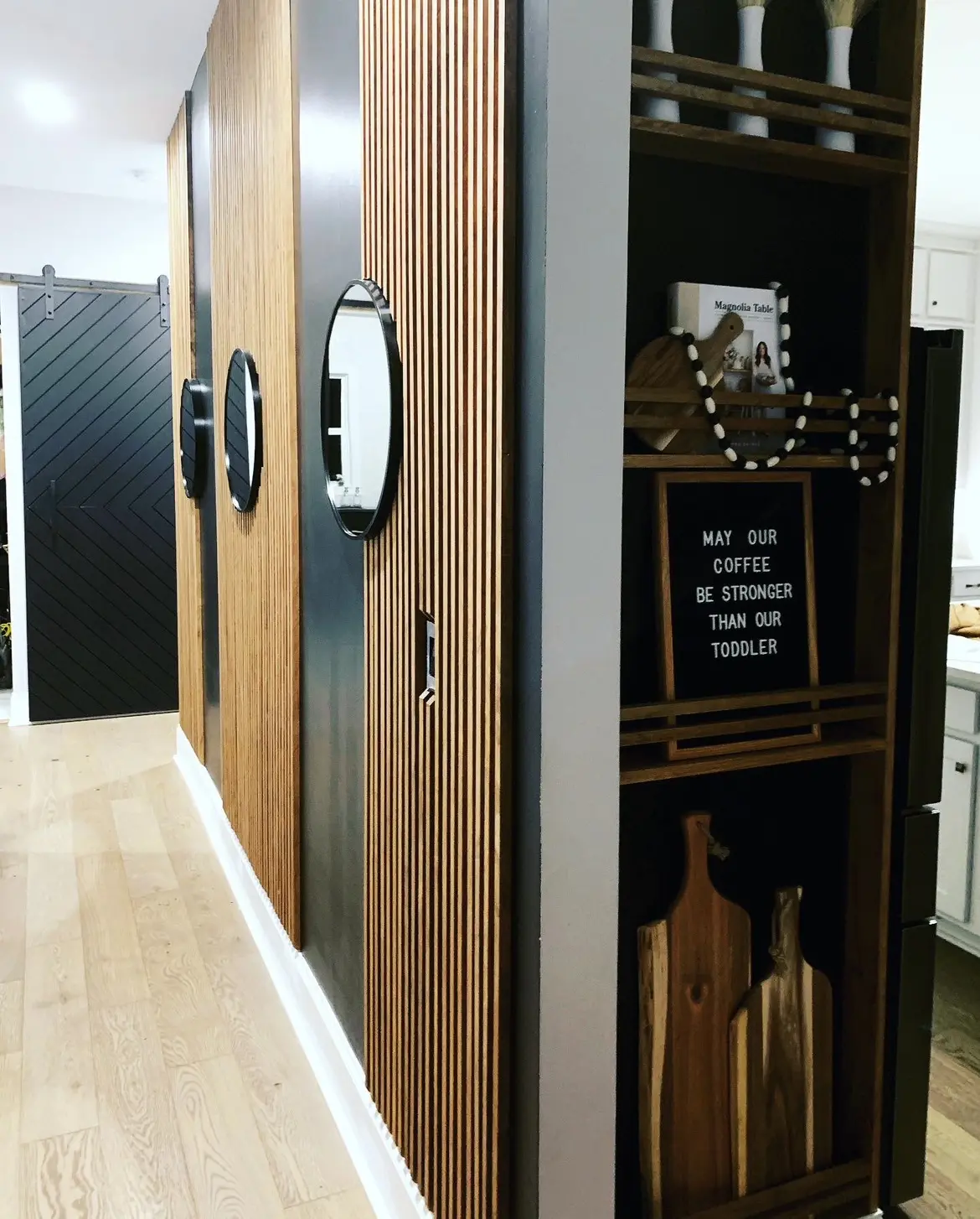 A wooden cabinet with some wine bottles on it